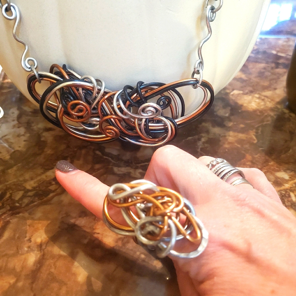 Handcrafted 3 piece set of mixed metals .